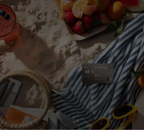 Citi® / AAdvantage® Platinum Select® World Elite Mastercard® surrounded by beach essentials